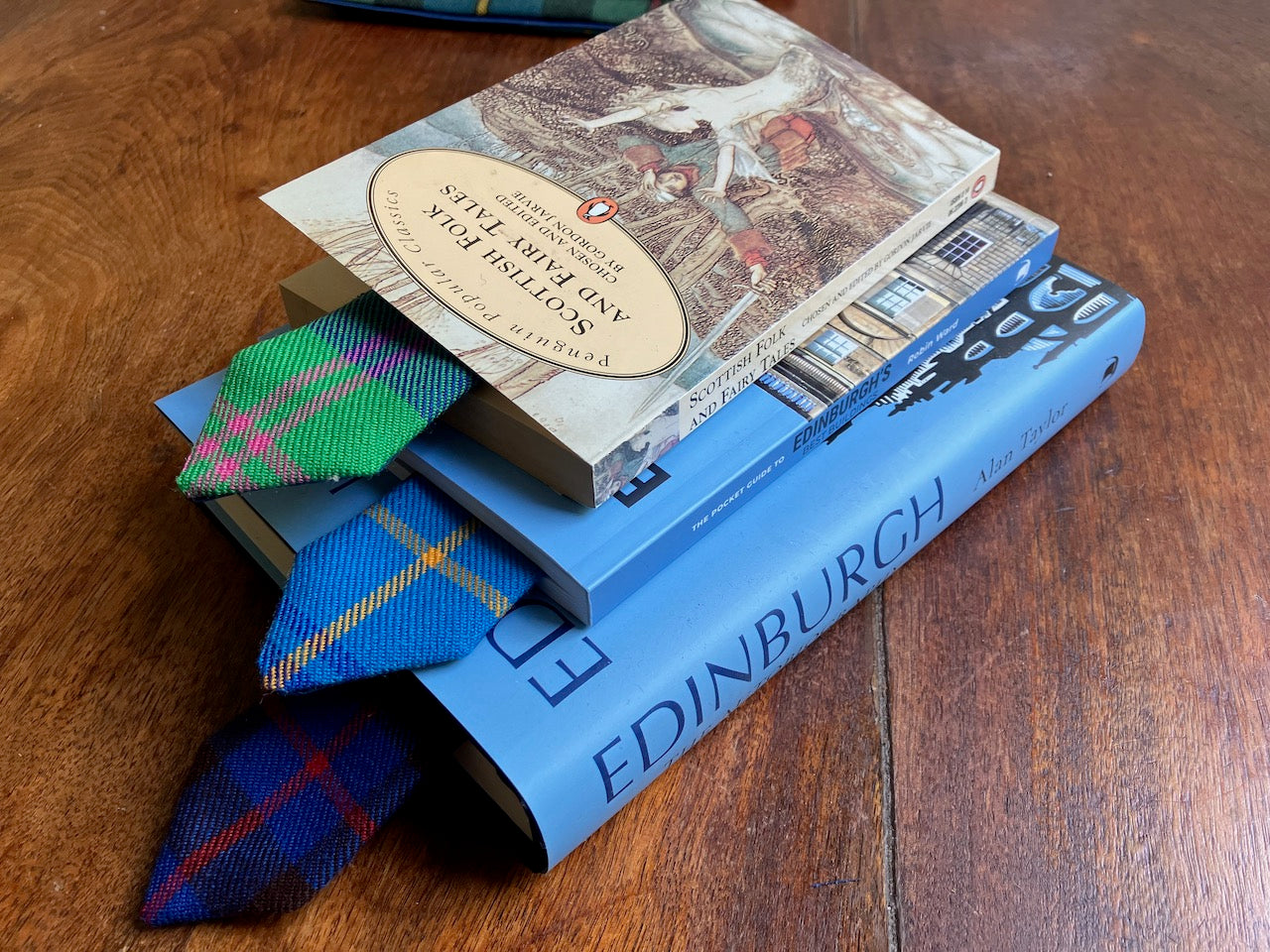 Pile of books with Tartan Bookmarks by Curlew Crafts