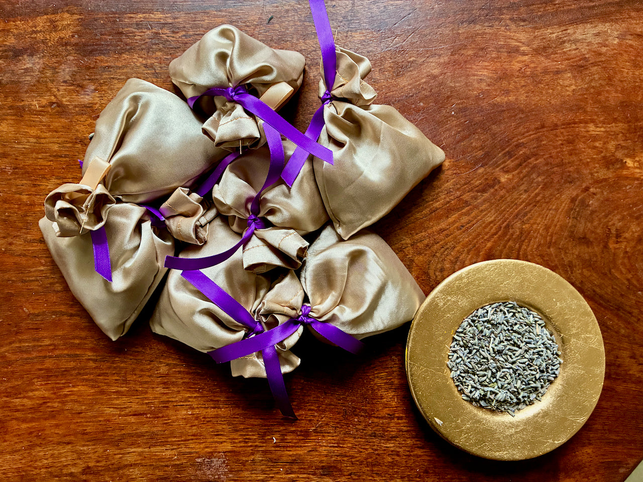 Gold Silk Lavender Sachets and a saucer of Dried Lavender