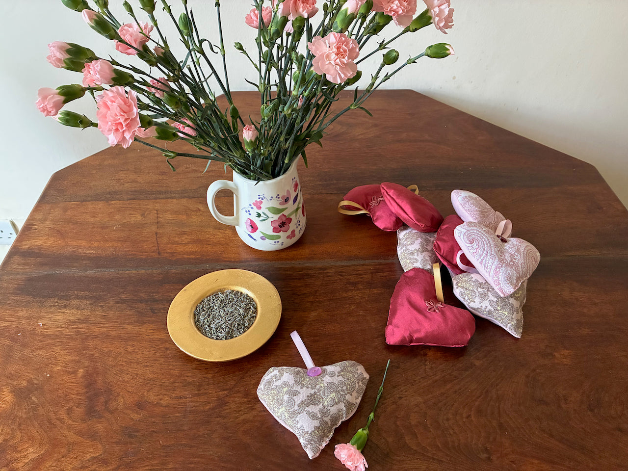 One Grey and Pink heart shaped Lavender Sachet with flowers and a bowl of dried Lavender