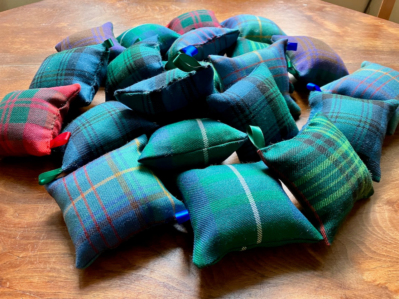 Pile of assorted Tartan Pin-Cushions by Curlew Crafts
