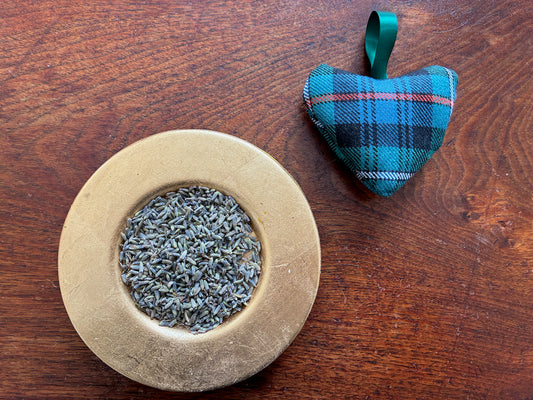 Single Small Tartan Heart Lavender Sachet by a saucer of Dried Lavender