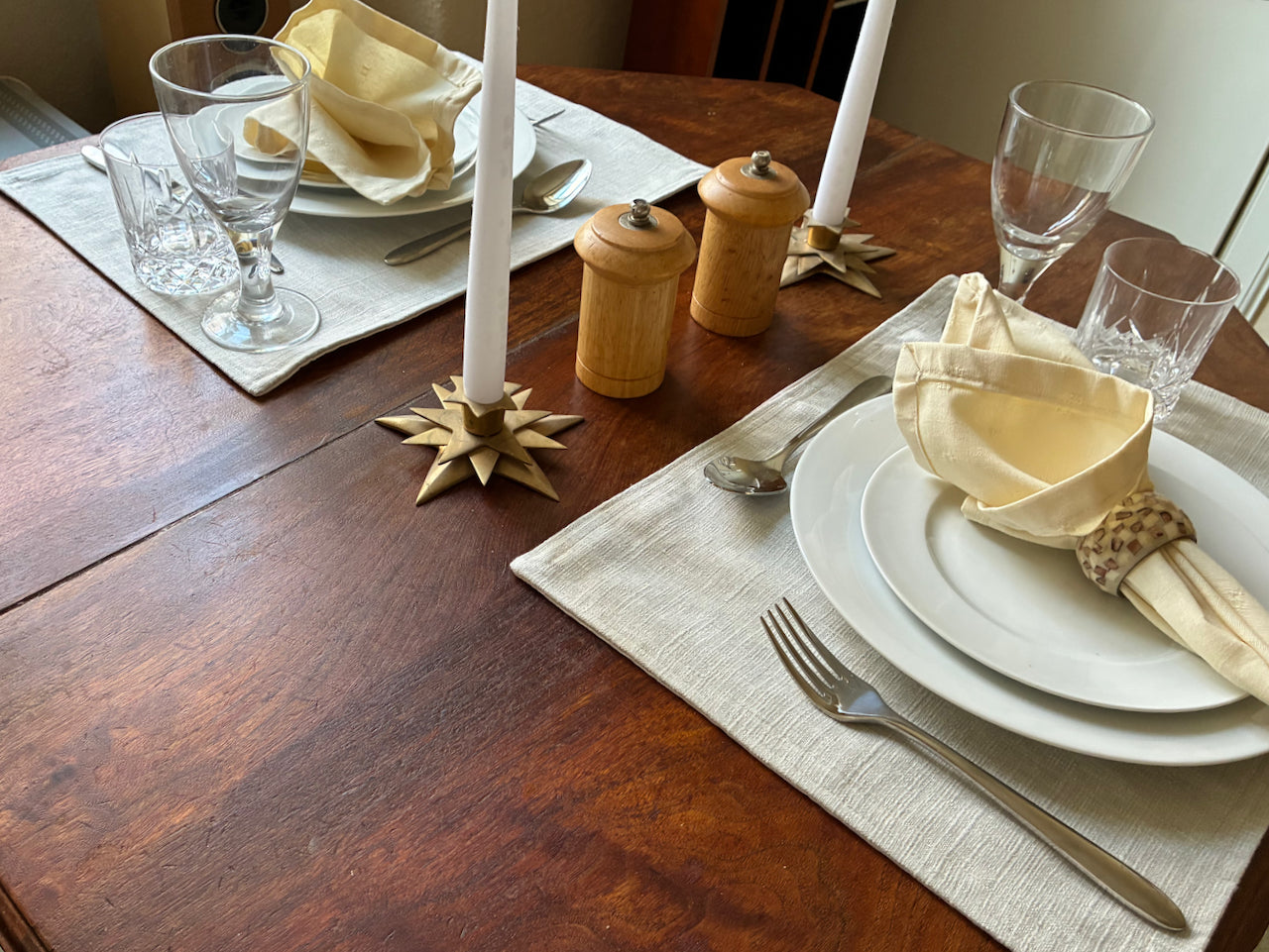 Table set for two people with Cream Brocade Napkins by Curlew Crafts