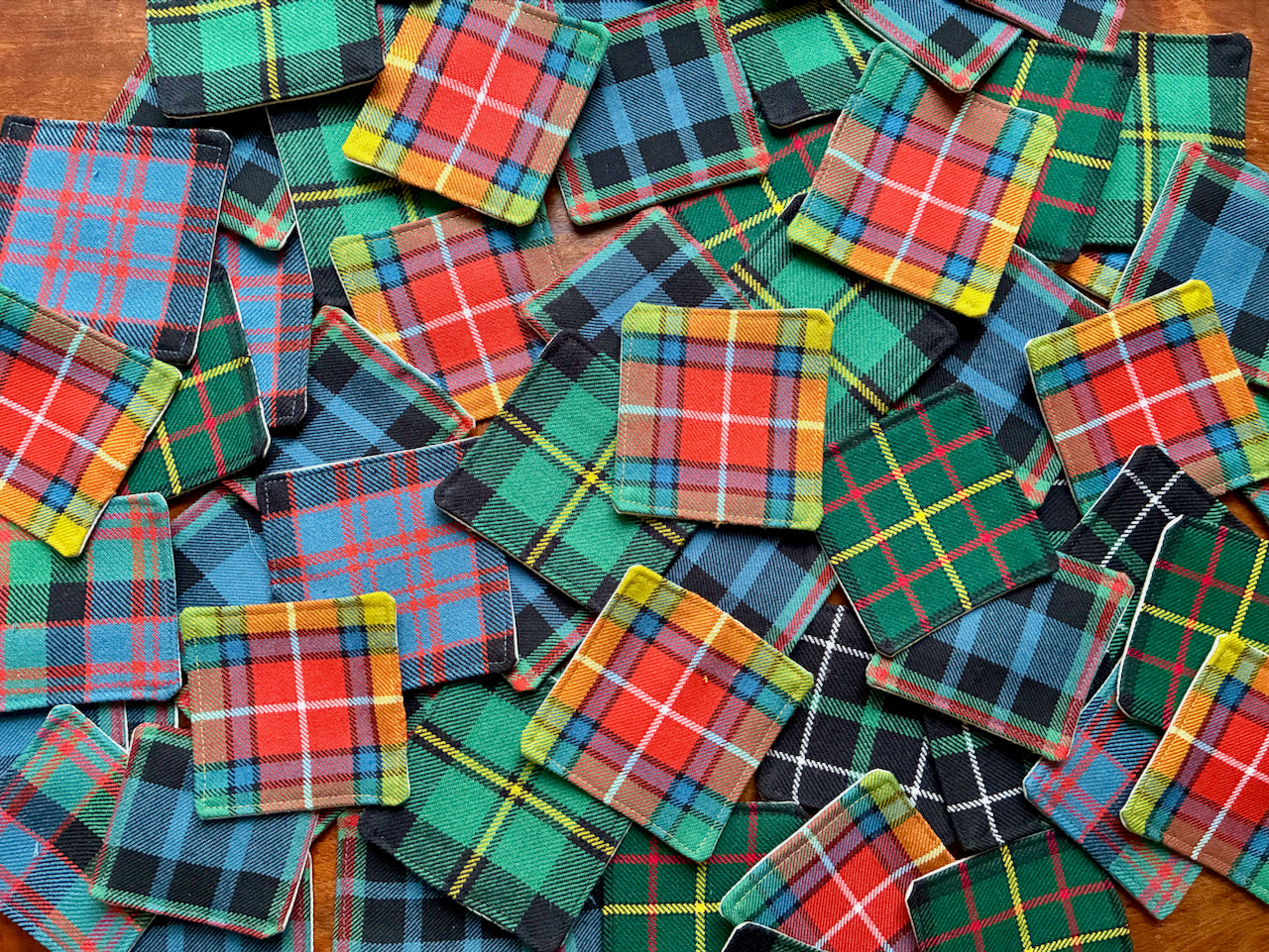 Collection of colourful Tartan Coasters by Curlew Crafts