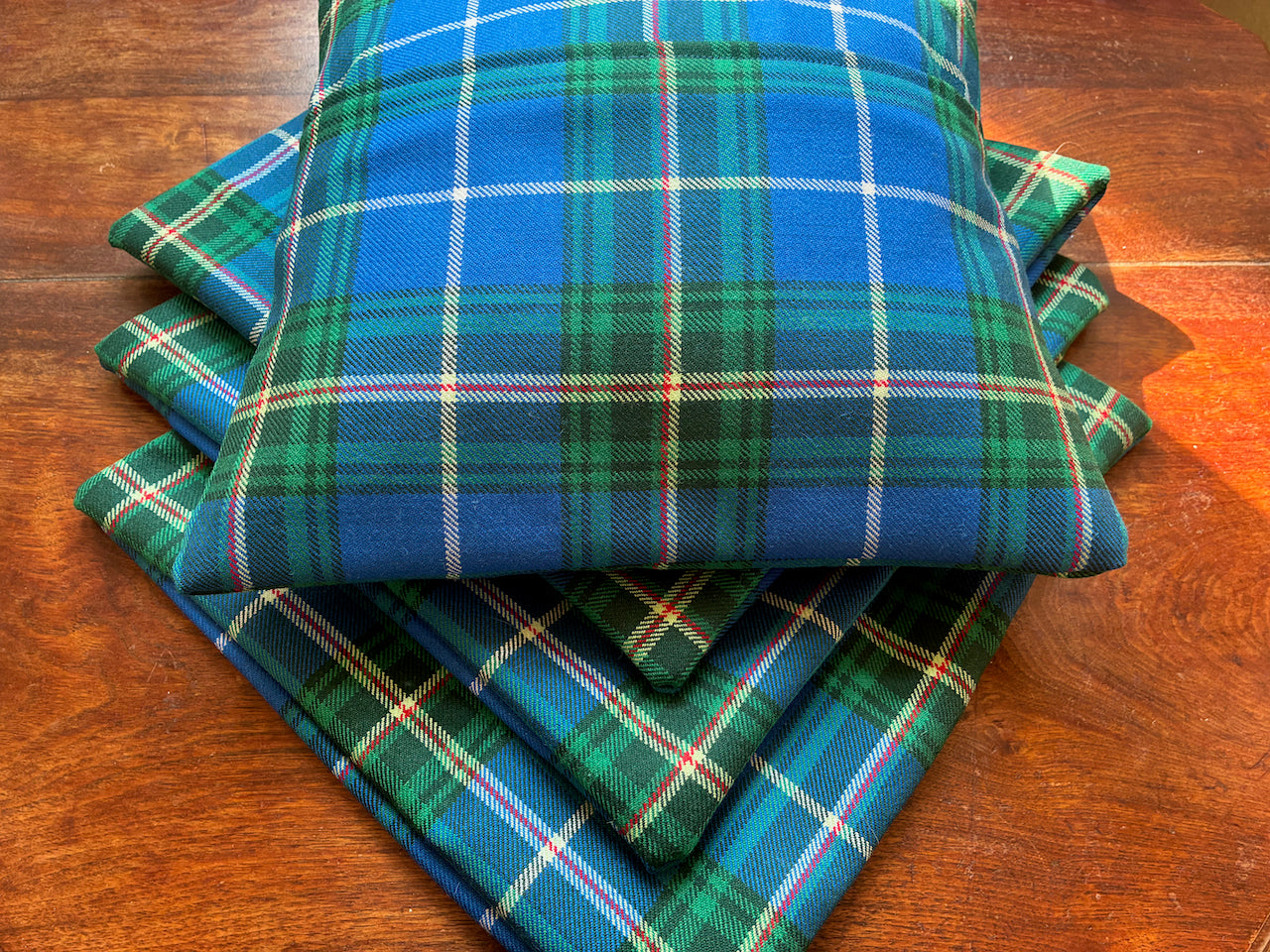Four Green and Blue Tartan Cushion Covers showing one full from the back