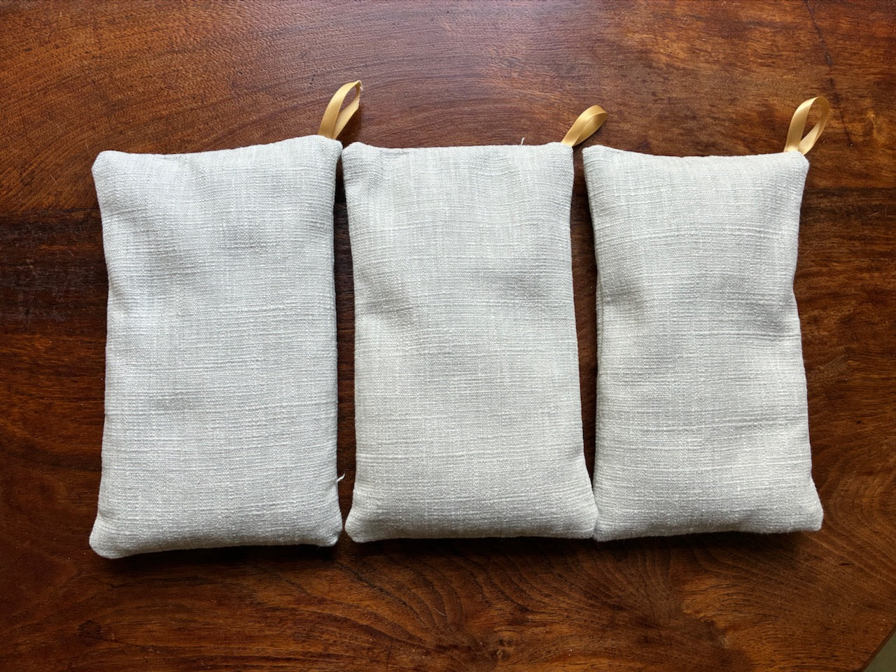 Three small Linen Wheat Bags with ribbon hook by Curlew Crafts