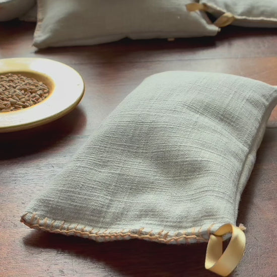 Small Linen Wheat Bag on a wooden surface