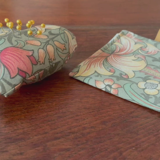 William Morris Sewing Set with Needle Case and Heart Pincushion on a wooden surface