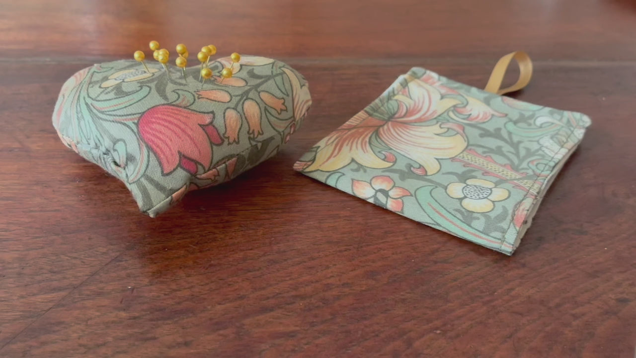 William Morris Sewing Set with Needle Case and Heart Pincushion on a wooden surface