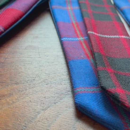 Assorted Tartan Bookmarks on a wooden surface