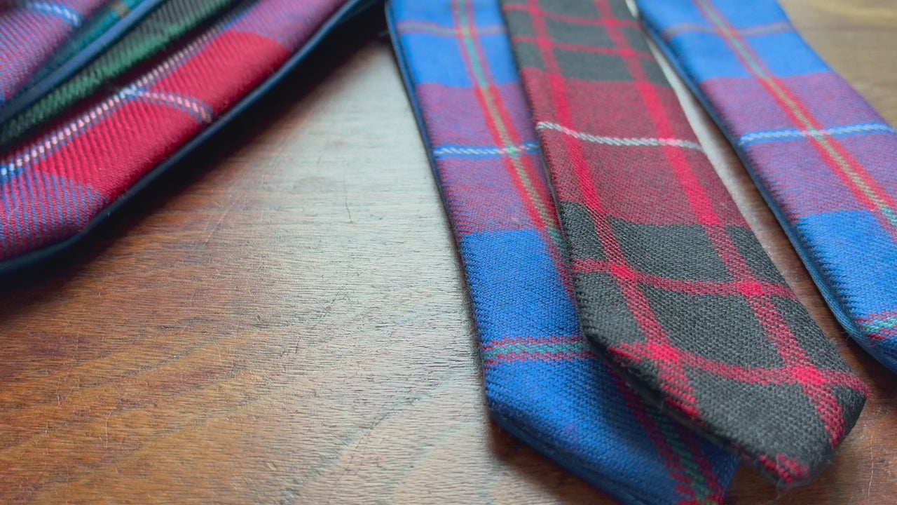 Assorted Tartan Bookmarks on a wooden surface