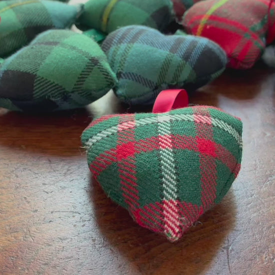 Tartan Heart shaped Pincushion swith Satin ribbon hooks on a wooden surface