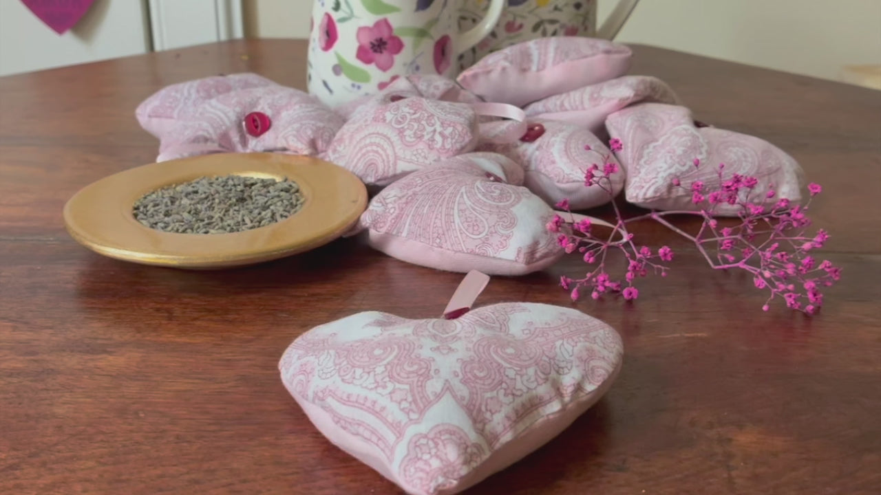 Red and White Paisley Heart shaped Lavender Sachet by some flowery jugs and a saucer of Dried Lavender